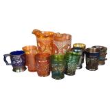 A Collection of Twelve Antique Carnival Glass Pitchers Mugs and Tumblers Including Northwood and Fenton