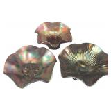 A Trio of Fenton Amethyst Carnival Glass Bowls in Orange Tree, Dahlia, and Thin Rib Patterns
