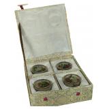 A Set of Four Chinese Plique-à-Jour Enamel Napkin Rings in Presentation Box
