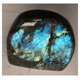 A LARGE POLISHED LABRADORITE SPECIMEN TOMBSTONE SHAPE.