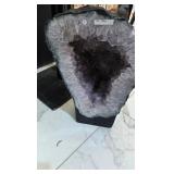 AN AMETHYST GEODE WITH POLISHED EDGES