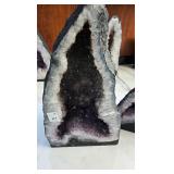 AN AMETHYST GEODE WITH POLISHED EDGES