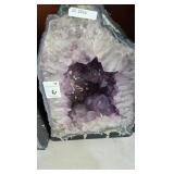 A LARGE AMETHYST GEODE POLISHED EDGES
