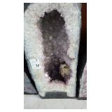 A LARGE AMETHYST GEODE POLISHED EDGES