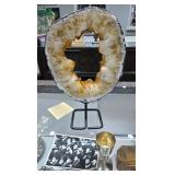 A LARGE AND BEAUTIFUL CITRINE RING ON A STAND