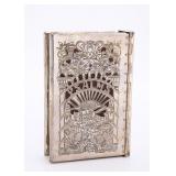 A STERLING SILVER TEHILLIM COVER BY SHUKI FREIMAN WITH TEHILLIM