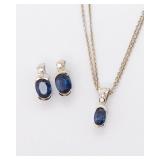 AN 14K DIAMOND AND SAPPHIRE PENDANT WITH CHAIN