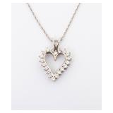 A 14K HEART PENDANT WITH  DIAMONDS with original chain