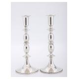 A PAIR OF SILVER WEIGHTED CANDLESTICKS. American, c. 1960