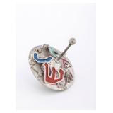 A SILVER AND ENAMEL DREIDEL BY SAMMY ZILKA, Israel, modern.