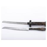 TWO STERLING SILVER HANDLED CHALLAH KNIVES.