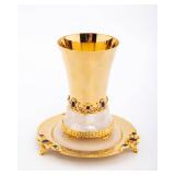 A PARCEL GILT STERLING SILVER AND WHITE ONYX KIDDUSH CUP AND UNDERPLATE. Davidoff