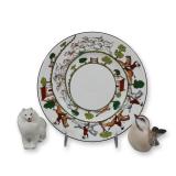Three Porcelain Items Including a Wedgwood Plate, a Lomonosov Dog Figurine, and a Dahl Jensen Bird