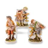 A Group of Three Polychrome Porcelain Figurines