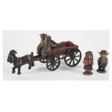 A Group of Antique Cast Iron Toys Including a Goat-Drawn Wagon and Figures