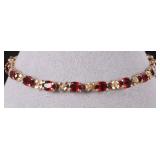 14K YELLOW GOLD LADIES BRACELET W/ GARNET STONES