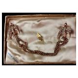 Two Mid-Century Figural Costume Jewelry Items Including an Enameled 10 Karat Gold Filled Soldier Pin and a Rhinestone Bird Sweater Guard
