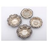 A GROUP OF FOUR STERLING SILVER SMALL BOWLS/BUTTER PATS