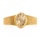 AN 18K GOLD LADIES WATCH BY UNIVERSAL GENEVE