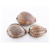 THREE JUDAICA CARVED COWRY SHELLS.