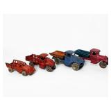 (4) Antique Cast Iron Trucks (G)