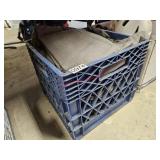 Milk crate of cold weather clothes - garage