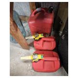 Three fuel cans, 5 gal and 1.25 gal (x2),  liquid