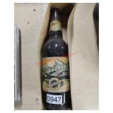 Vintage glass bottle of liquid- garage