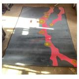 multi-color abstract design rug. (Garage)
