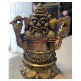 brass double-sided statue featuring the Hindu god