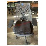 computer chair with spare cushions (garage)