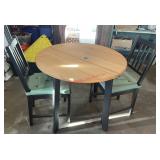circle dining table with two chairs (garage)