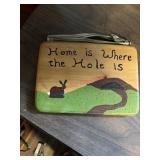 'Home is where the hole is' wood Sign