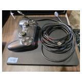 Playstation 4 with cords and wireless remote-