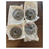 Four malleable iron floor flanges. (Backhouse)