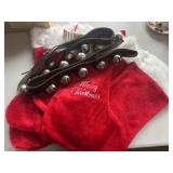 Lot of Red Christmas Stockings and Reindeer Bells