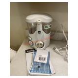 Waterpik water flosser lot (downstairs bathroom)