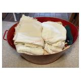 Bucket full of liens and towels (master bedroom)