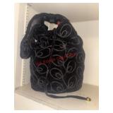 Slouchy Bag filled with coin purse and small hand