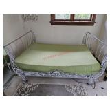 Cast iron sleigh bed with cushions, buyer to