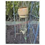 Metal rack with damaged flower pots - side of