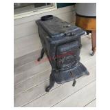 Rustic-style cast iron wood-burning stove  (RIght
