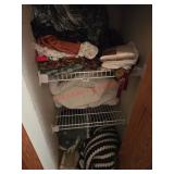 Multiple Shelves of Blankets and linens