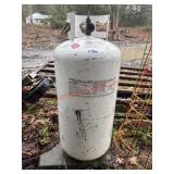 Slender Propane tank        (BACK UNDER COVERED