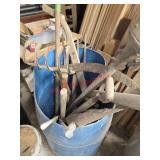 Blue Barrell full of Yard Tools. Some are