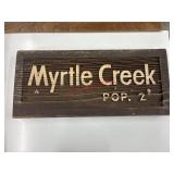 Myrtle creek sign (garage side room)