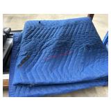 blue quilted moving blanket few  tears(garage)