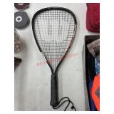 Wilson tennis racket (garage side room)