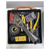 Box filled with various hand tools (garage side