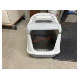 Cat litter box (garage side room)